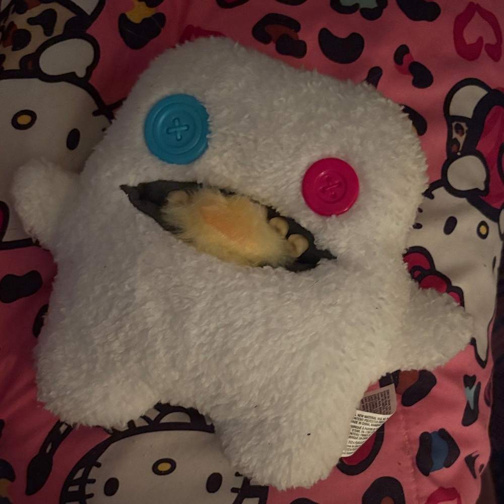 White and Pink Stuffed Monster Toy